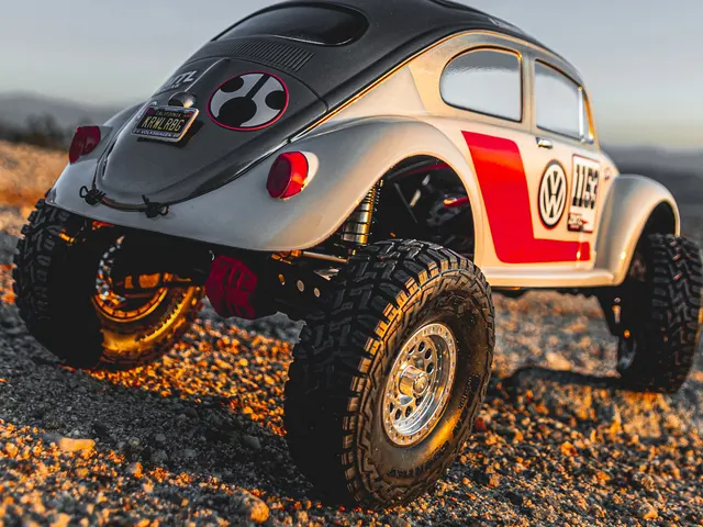 A painted classic bug body on a scale crawler at dusk